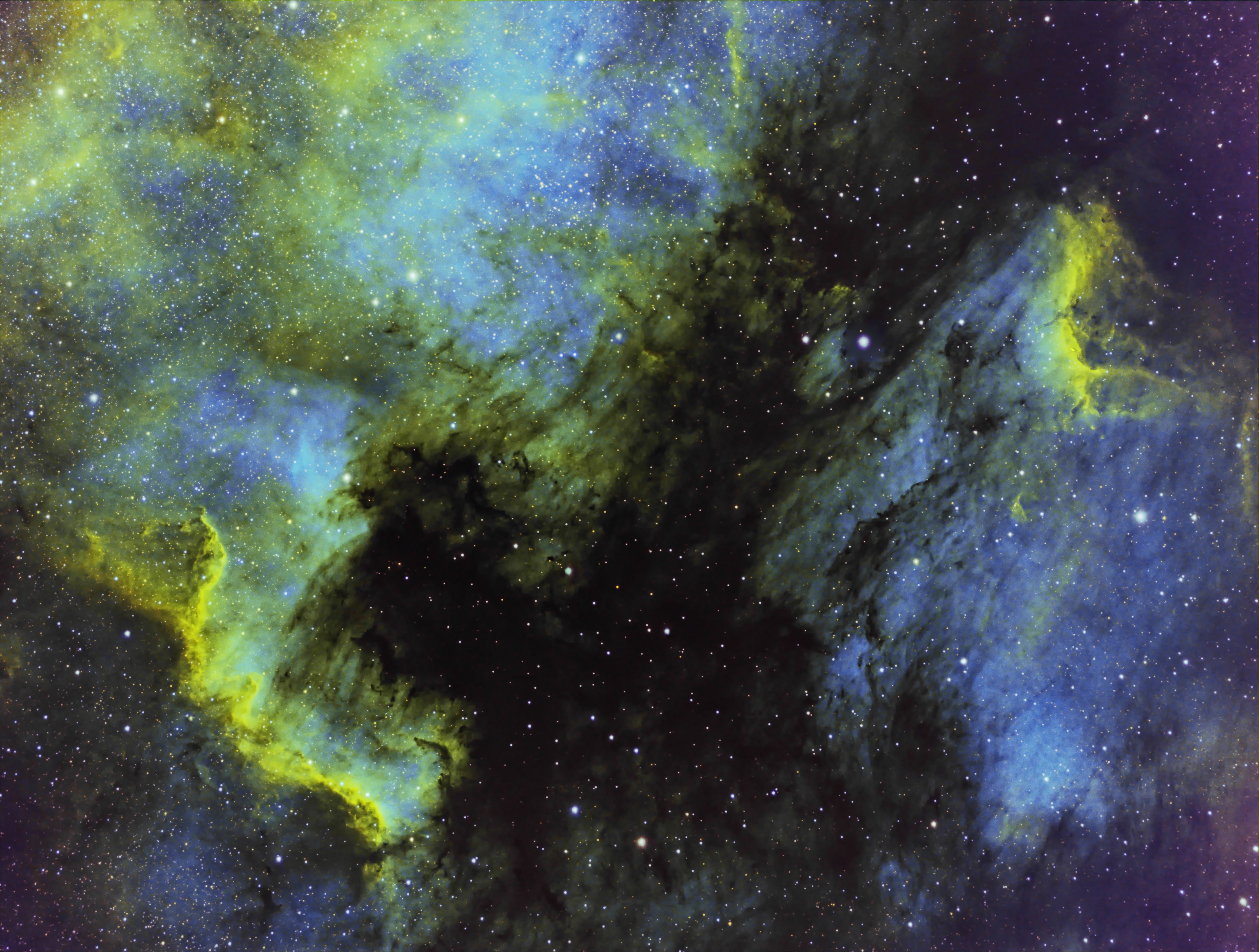 North American and Pelican Nebulas in narrowband HSO, Hubble Pallette.